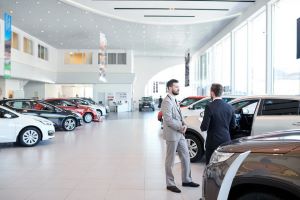 Vehicles displayed in a dealership showroom, ready for dealer-to-dealer auto transport.